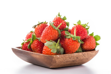 A bowl of beautiful strawberries isolated on white background with clipping path, close up, macro.
