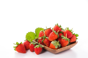 A bowl of beautiful strawberries isolated on white background with clipping path, close up, macro.