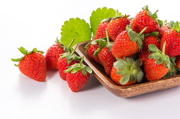 A bowl of beautiful strawberries isolated on white background with clipping path, close up, macro.