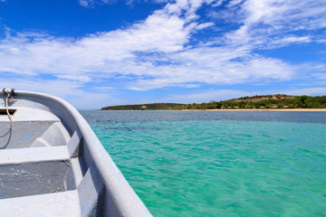 Fototapeta na wymiar Fishing boat in the caribbean, turquoise sea on the coast. Dominican Republic.