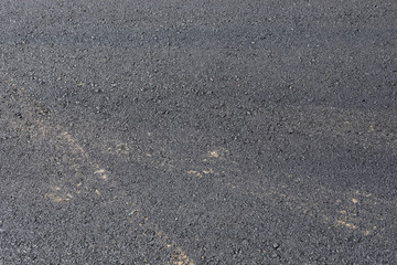 black asphalt construction road with tarmac surface material industry