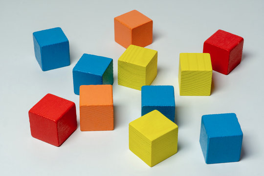 Colorful wooden childen's building blocks scattered loose