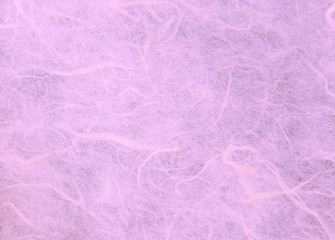 Fototapeta premium Purple handmade mulberry paper texture background.Natural rough rice craft sheet textured pattern close up.Selective focus.