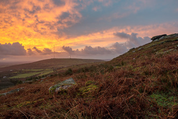 Fototapeta na wymiar Sunrise over Bodmin Moor, with beautiful colours clouds in the sky , Cornwall, UK