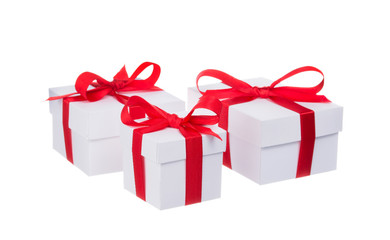 Stack of presents white gifts ribbon red bow isolated on white background