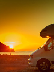 Fototapeta na wymiar Camper car on nature at sunrise. Travel