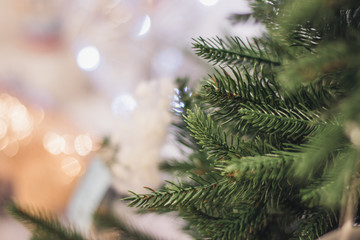 Christmas tree background and Christmas decorations, blurred, sparkling, glowing. Happy New Year and Christmas