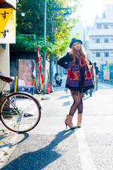 Asian female model poses for pictures on the street