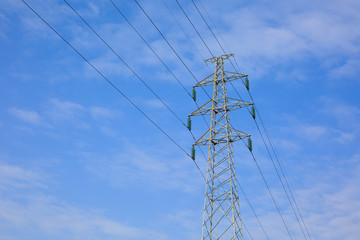 A high voltage tower is under the blue sky - 239152593