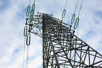 A high voltage tower is under the blue sky - 239152712