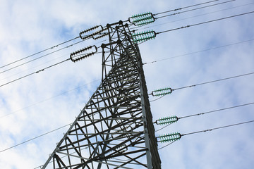 A high voltage tower is under the blue sky - 239152732