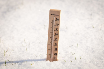 thermometer in snow, winter and snowfall.