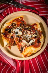 A piece of homemade pizza.