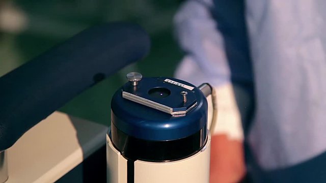 laser for vision correction, Surgeon's hands in gloves performing laser eye vision correction correction, medical laser close up, Doctor is testin a medical laser