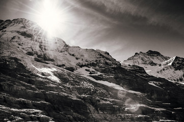 Obraz premium Panoramic view of rock cliff, Jungfrau peak view from Kleine Scheidegg station, Switzerland