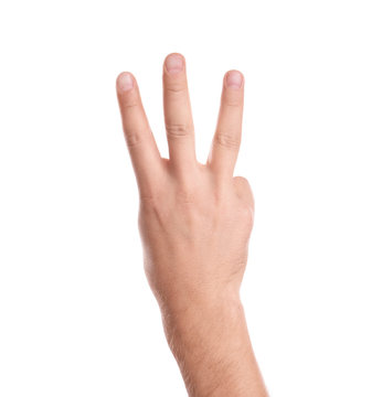 Man showing three fingers on white background, closeup of hand