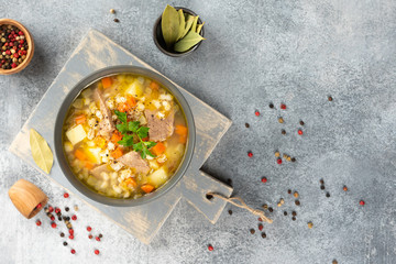 Rassolnik - Traditional Russian soup with pickled cucmbers, pearl barley, meat, pickles, carrots...