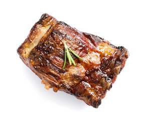 Delicious barbecued ribs with rosemary on white background, top view