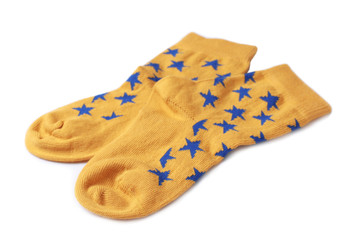Pair of cute child socks on white background