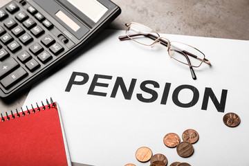 Paper with word PENSION, glasses, calculator and money on table