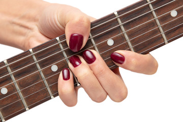 Girl playing an electric guitar on white background