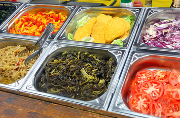 self service canteen with breaded meat cutlet tomatoes and cooke