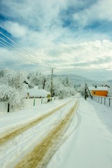 unbelievable winter landscape,  houses in ukrainian village, spectacular frosty cloudy weather, amazing rural nature scenery, Carpathian mountains, Ukraine, Europe