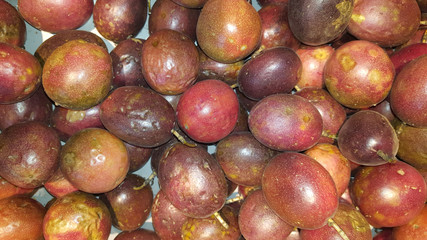 passion fruit on a shelf at the market for sale usable for background