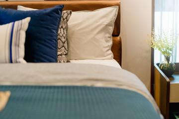 Bed maid-up with clean white pillows and bed sheets in beauty bedroom. Close-up. interior background