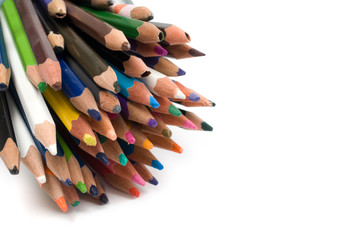 Bunch of colored pencils isolated on white background. Selective focus.