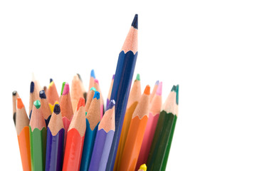 Bunch of colored pencils isolated on white background. Selective focus.