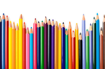 Colored pencils in a row isolated on white background.
