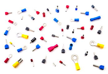 Pile of electrical connectors isolated on white background closeup