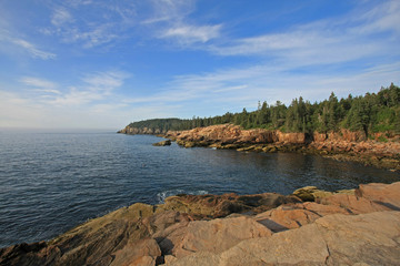 The rugged coast of Acadia National Park, Maine, bathed in early morning light in summer.