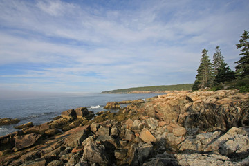 The rugged coast of Acadia National Park, Maine, bathed in early morning light in summer.