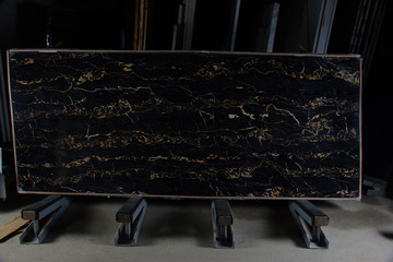 Black marble with yellow veins Nero Portoro on a stand