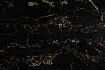 Black polished marble with yellow veins Nero Portoro as background