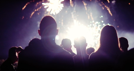 Crowd watching fireworks and celebrating new year eve