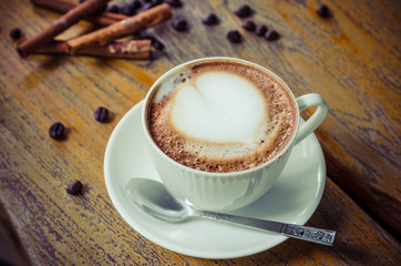cup of coffee on wooden table