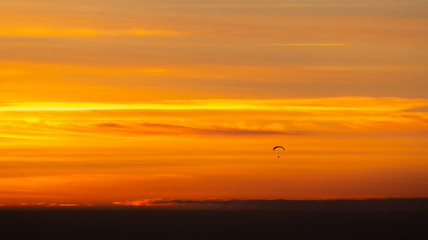 Parachutist in the sunset.