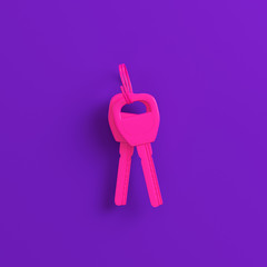 Pink home or car keys on purple background. Minimalism concept