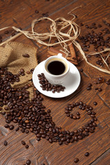 White cup of coffee with beans