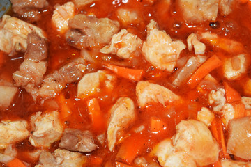 Stew close-up. Pork in sauce.