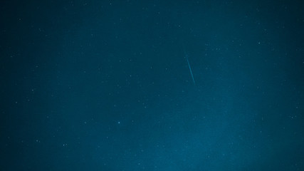 blue background tone with night sky concept from Geminids one of the most spectacular meteor showers of the year and other small star with night sky