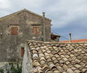 Old traditional stone house and roof in Village Krini, corfu, greece, vintage look