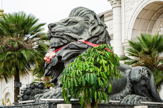 big black lion statue front of building.