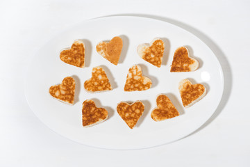 plate of pancakes in the shape of heart