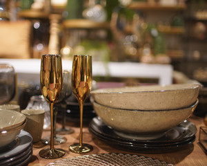 Table decoration for a special occasion - plates and glasses. Festive modern decoration and tafelware. Cozy atmosphere- Image