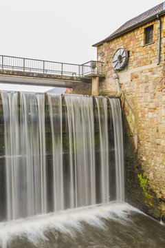beautiful image of a small dam on Doyards lake in Vielsalm on a wonderful autumn day in the Belgian Ardennes