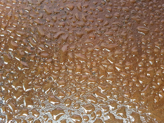 The rain drops on metal surface